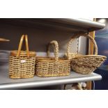 A wicker bottle holder and two wicker baskets as new