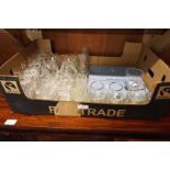 A box of assorted glasses and a Wedgwood collectors plate