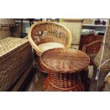 A wicker tub chair and a circular table as new