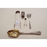 A London silver and gilt berry spoon, muffin fork,