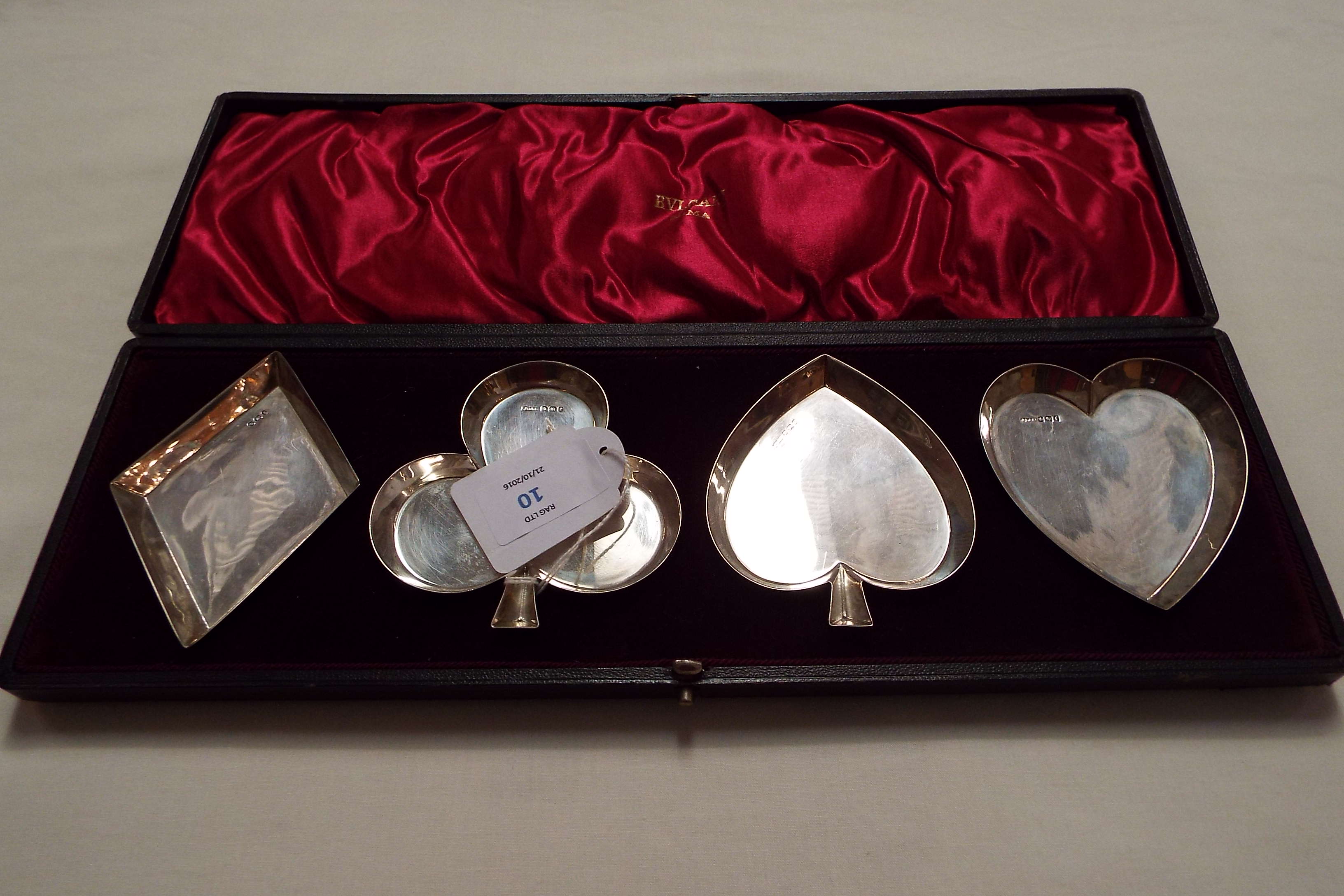 A boxed set of Sheffield 1898 silver pin dishes in the form of playing cards suits