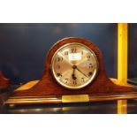 An oak cased mantle clock having Arabic numerals eight day movement and Westminster chime