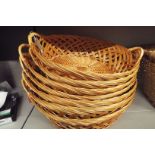 Seven wicker shallow baskets as new