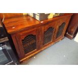 An Indonesian teak three door sideboard