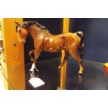 A Royal Doulton figurine of a trotting horse