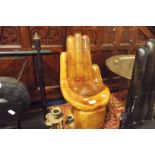 A carved hand child's seat