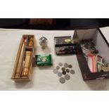 A selection of coins, banknotes, ranger compass,