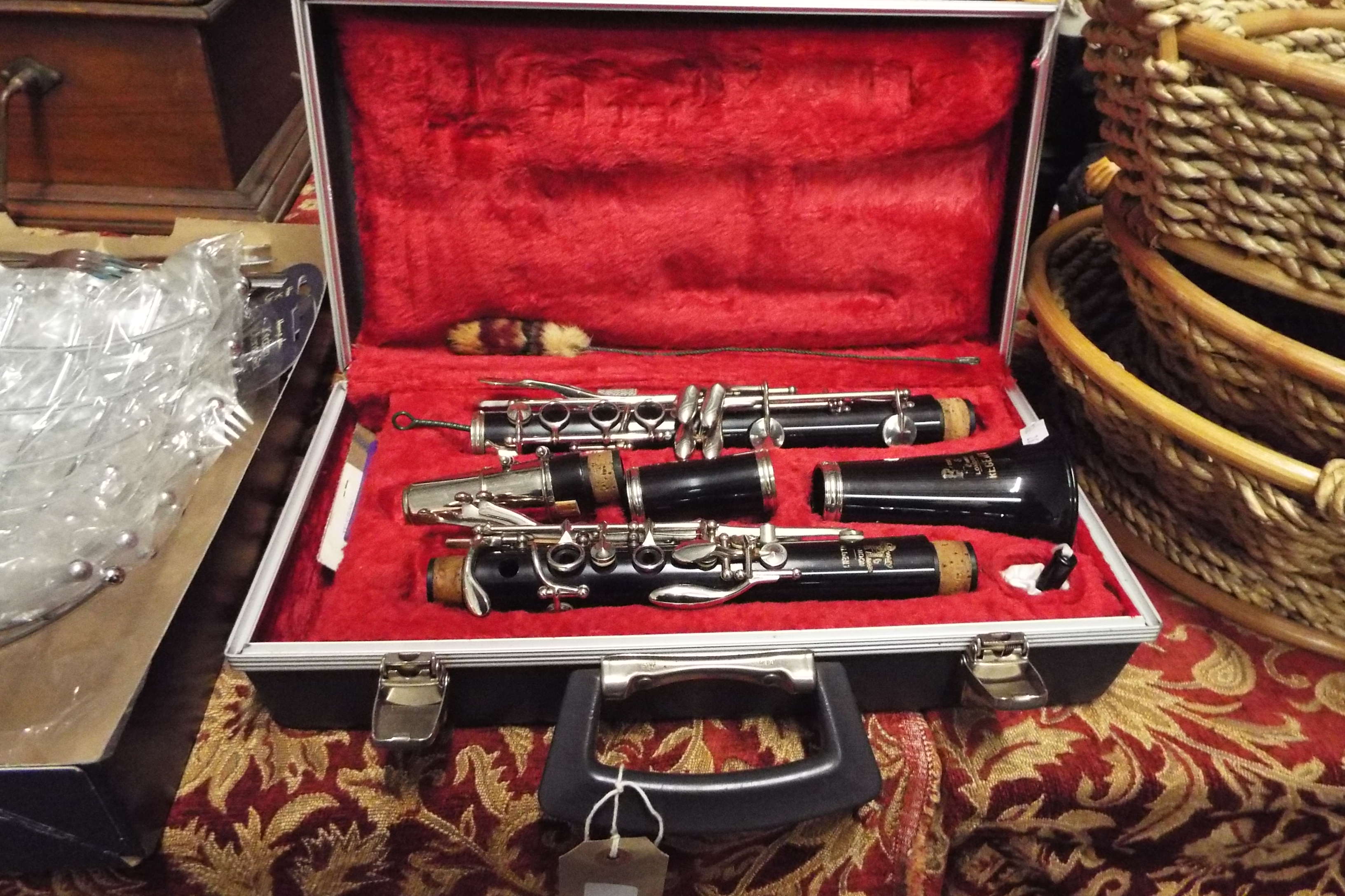 A Boosey & Hawkes ebonised clarinet in original hard case