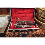 A Boosey & Hawkes ebonised clarinet in original hard case