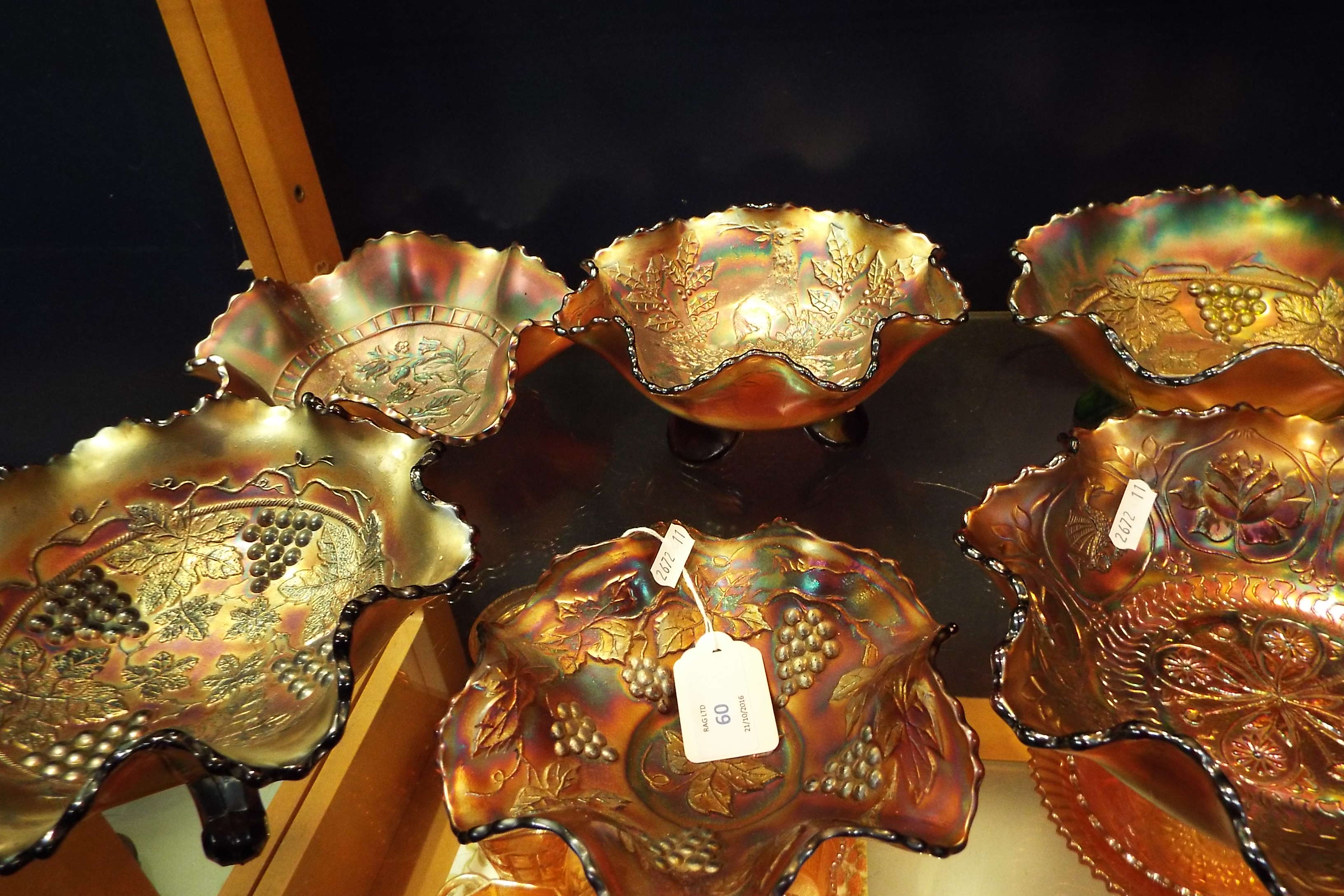 A group of six carnival lustre glass bowls with fluted rims fruit berry and floral decoration