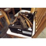 A box of assorted horse tack,