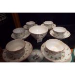 A set of six early 19thC china tea-bowl saucers and a finger bowl with hand painted decoration