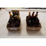 A selection of miniature bottles to include Guinness, Carlsberg, Grant's Cherry Brandy,