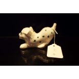 A rare miniature Rye pottery white glazed dog with spot and star decoration signed David Sharp