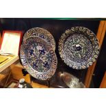 Three vintage Iznik plates with stylized decoration one has been repaired split