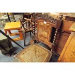 A Victorian oak side chair with floral carved back and barley twist supports over a caned seat and