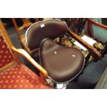 A retro chrome and brown leather swivel chair