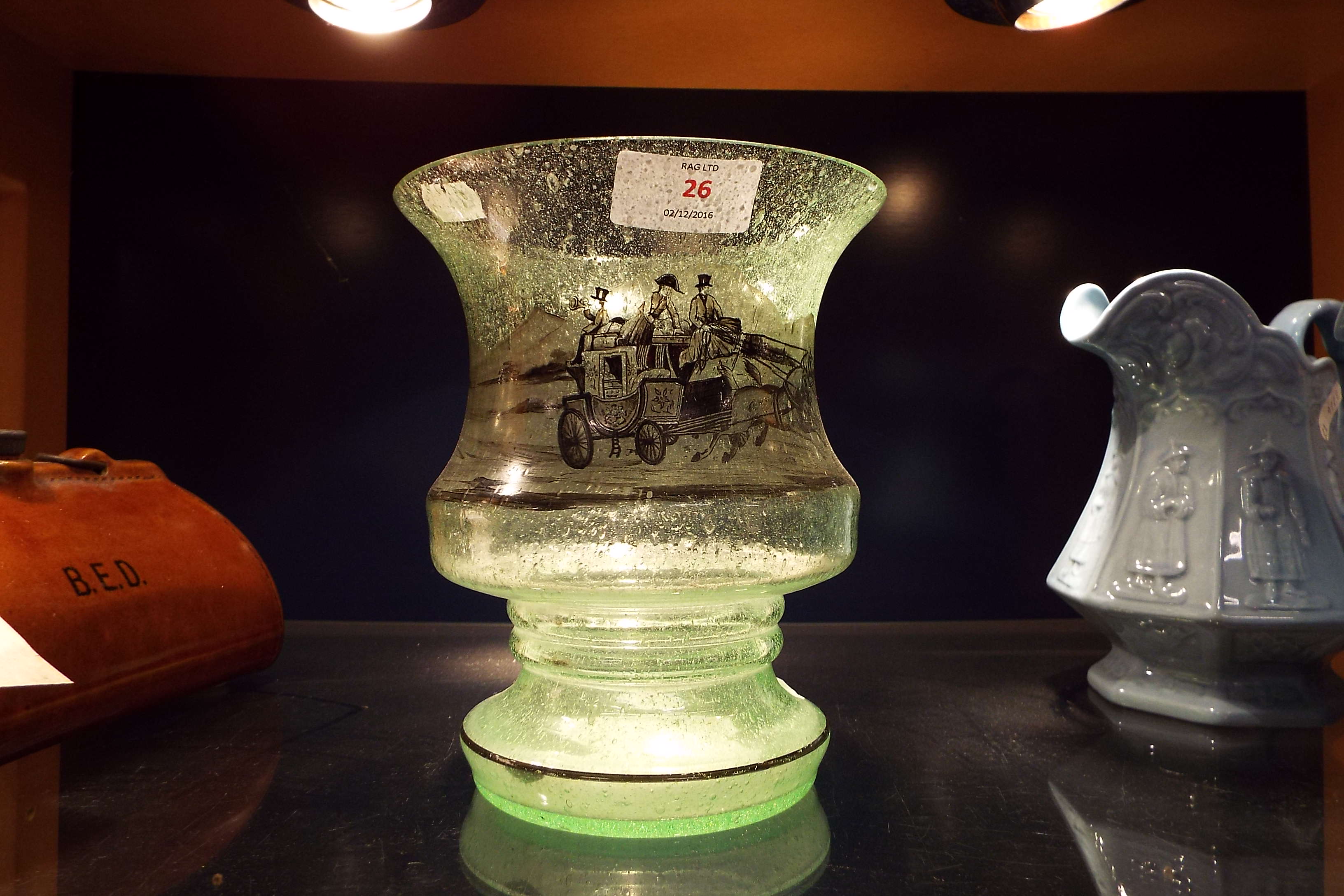 A frosted glass vase having coaching scene