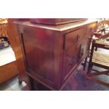 A mid-20thC oak sideboard fitted with two short drawers above a pair of floral panelled cupboard