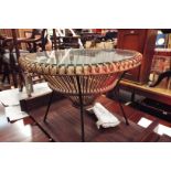 A 1960s wicker Sputnik style circular coffee table