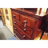 A Victorian mahogany chest of two short over three long graduating drawers and fitted with turned