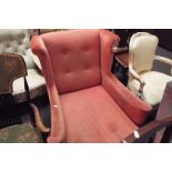 A Victorian club armchair in salmon pink upholstery