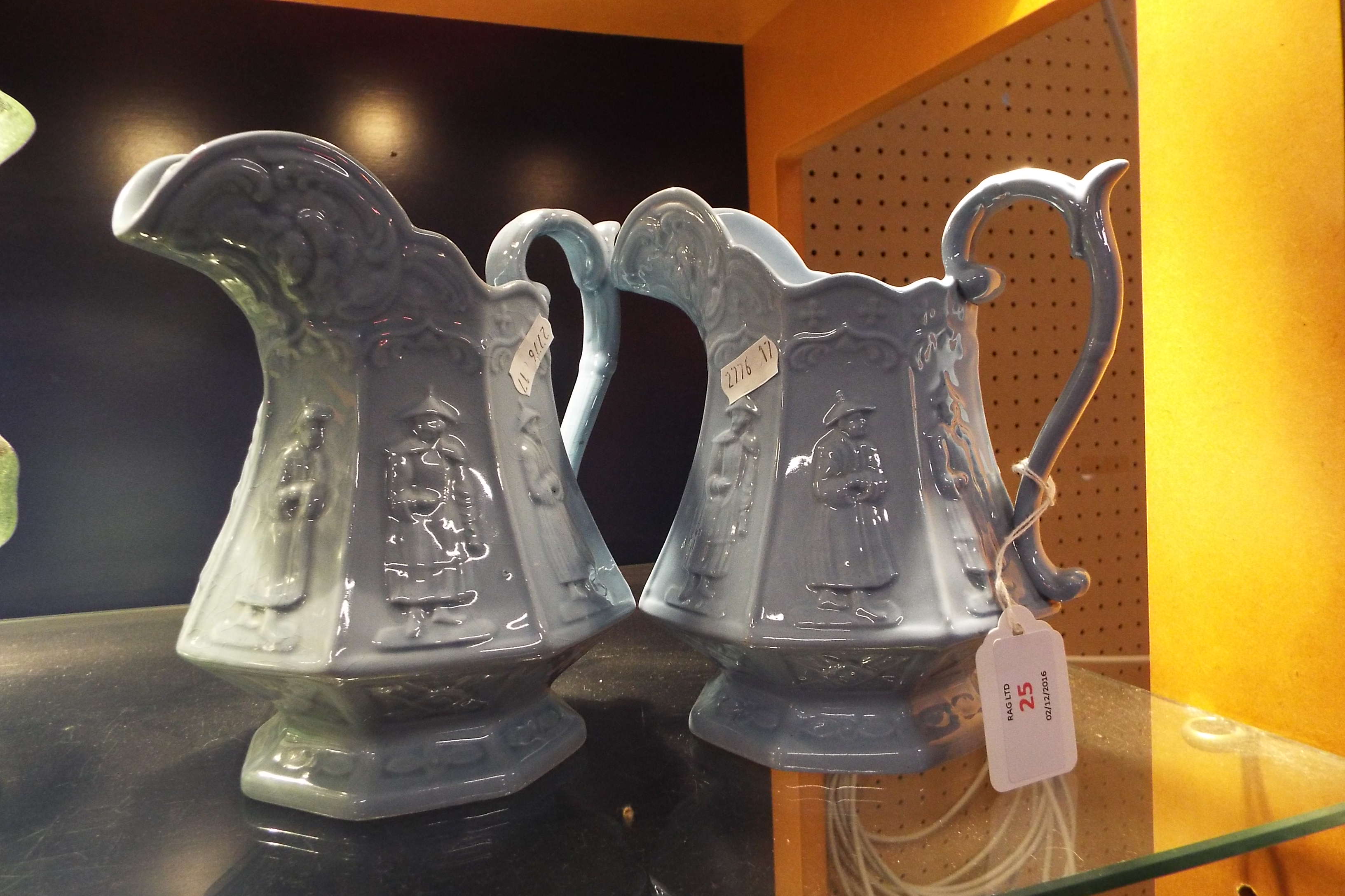 Two blue glazed jugs depicting Oriental gents