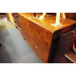 A George III mahogany dining table on square supports