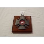 A WWI French memorial cross on wooden plaque