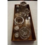 A selection of silver topped items to include pill pot, salt and pepper,