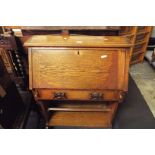 An early 20thC oak student's bureau,