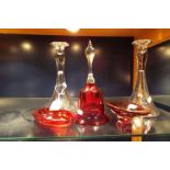 A pair of glass candlesticks, and ruby red glass vase,