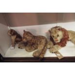 A pre-1950s plush lion and leopard together with a similar puppy