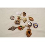 A collection of ten French metal and enamel military badges