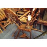 An antique oak bobbin turned spinning wheel (slight damage)