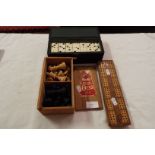 A Staunton chess set, bone dominoes and