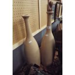 A pair of brown glazed tall neck vases