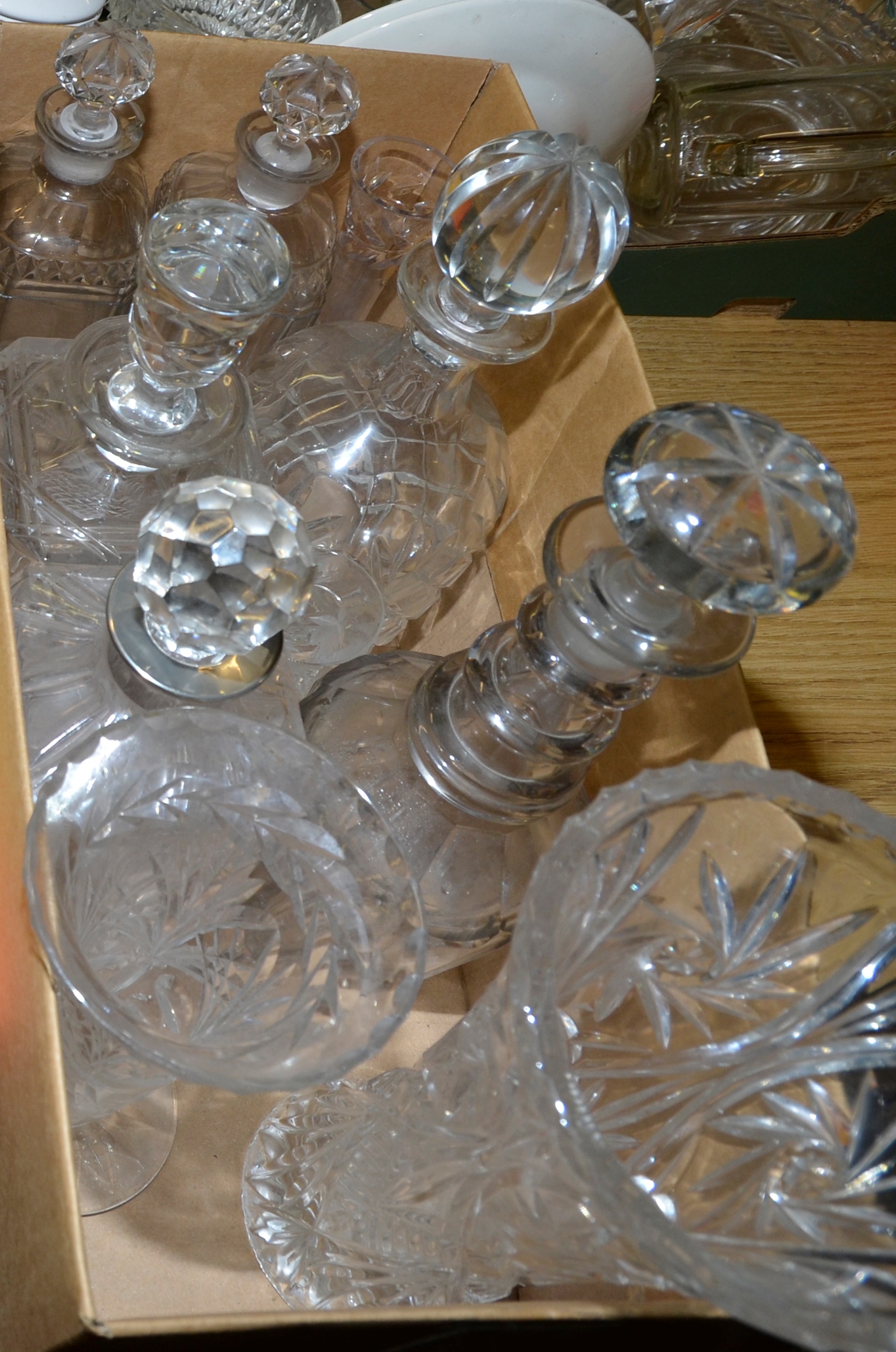 Box of assorted cut glass decanters and vases