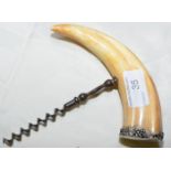 Late 19th C corkscrew, the handle formed from a boars tusk with white metal mounts engraved T. O. L.