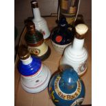 Selection of ceramic decanters including Bells, Black Prince etc.