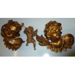 Pair of gilt cherubs and one other