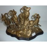 Brass figure group depicting rams on mountainous base