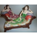 Pair of Regency fine Arts 'Chaise Longue' ornaments