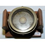 Wood mounted brass ships compass on gimbal,