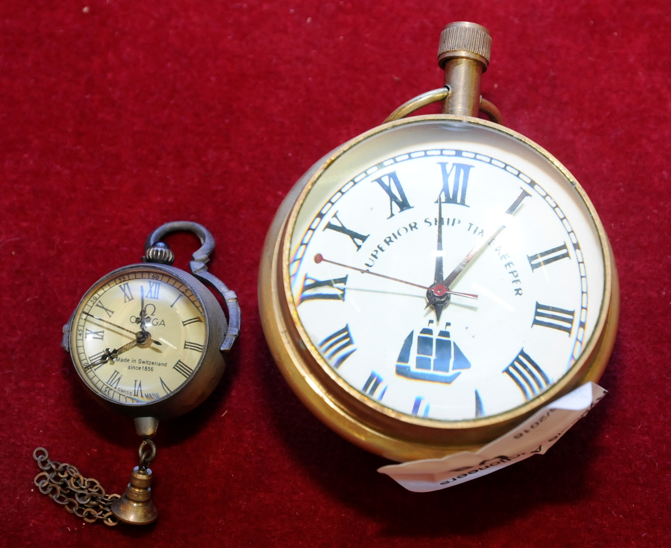 Superior Ship timekeepers reproduction globe style watch and another similar hanging globe watch