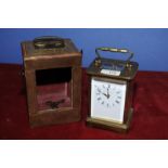 Brass cased carriage clock, the white dial named Matthew Norman, Swiss made,