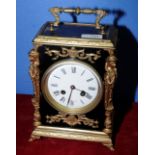 French striking ebony and gilt cased mantel clock with plain white enamel dial,