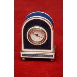 Continental silver and enamel miniature clock the white enamel dial marked 8 days,