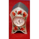 Birmingham silver and enamel cased clock with white enamel dial and enamel poppy floral panel to