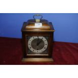 Small mahogany cased bracket clock by Smiths with brass and steel dial